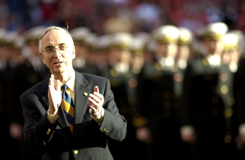 US Navy 031230-N-9693M-003 The Secretary of the Navy, the Honorable Gordon R. England following the march on of the Midshipmen during opening the opening ceremonies for the EV1.Net Houston Bowl at Reliant Stadium in Houston, Te