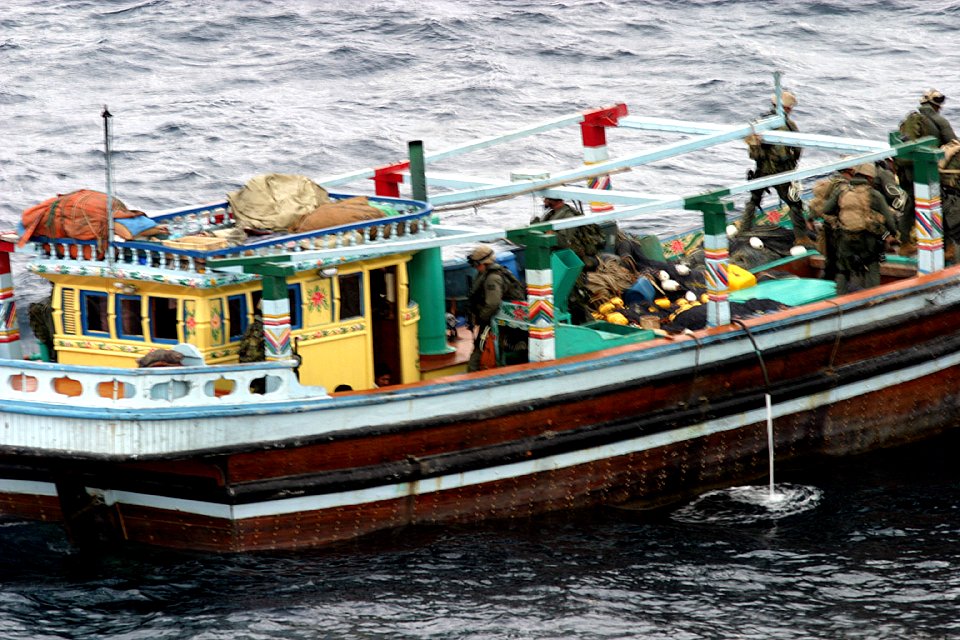 US Navy 031231-N-2295R-006 Boarding teams from the 13th Marine Expeditionary Unit (Special Operations Capable) assigned to Expeditionary Strike Group One (ESG 1) inspect a dhow found trafficking over 2,800 pounds of narcotics