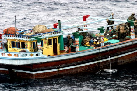 US Navy 031231-N-2295R-006 Boarding teams from the 13th Marine Expeditionary Unit (Special Operations Capable) assigned to Expeditionary Strike Group One (ESG 1) inspect a dhow found trafficking over 2,800 pounds of narcotics