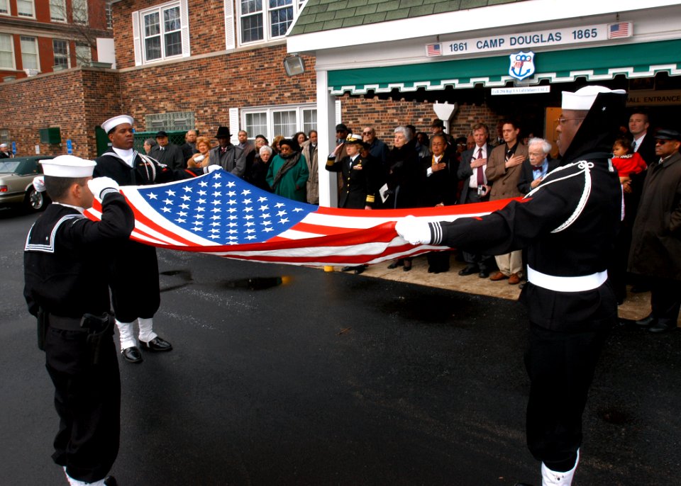 US Navy 040221-N-2899A-001 Sailors assigned to the Naval Station Great Lakes Funeral Detail fold the National Ensign in honor of William Sylvester White