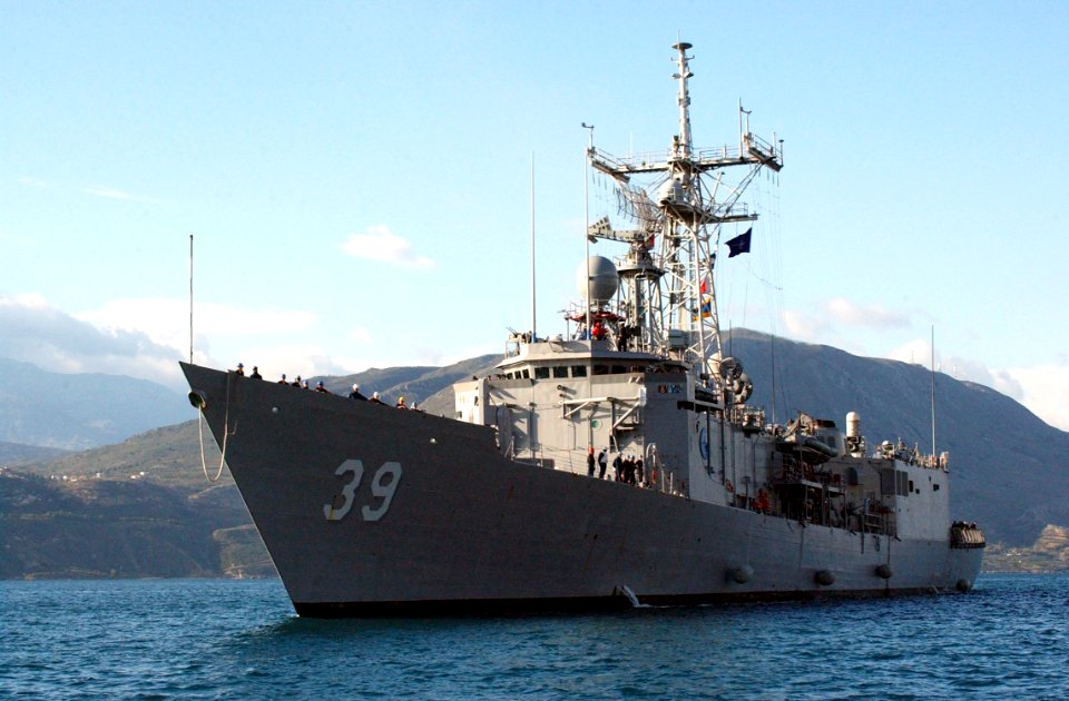 US Navy 031216-N-0780F-036 The guided missile frigate USS Doyle (FFG 39) is assisted by Greek tugs as she arrives for a brief port visit in Souda Bay, Crete, Greece