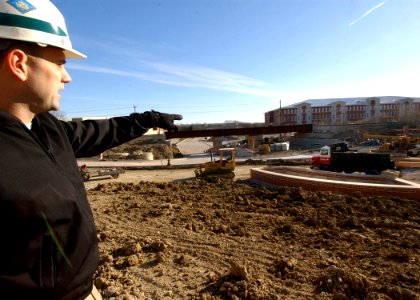 US Navy 031202-N-5576W-002 Lt. Dan Cook, deputy resident officer in charge of construction for Camp John Paul Jones at the Recruit Training Command (RTC) Great Lakes, explains the progress of construction