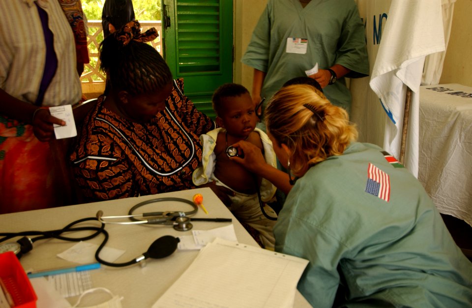 US Navy 040114-N-3236B-016 Chief Hospital Corpsman Blanca Mendez, the Independent Duty Corpsman (IDC) for the 13th Marine Expeditionary Unit (MEU) Special Operations Capable (SOC), examines a young Kenyan infant