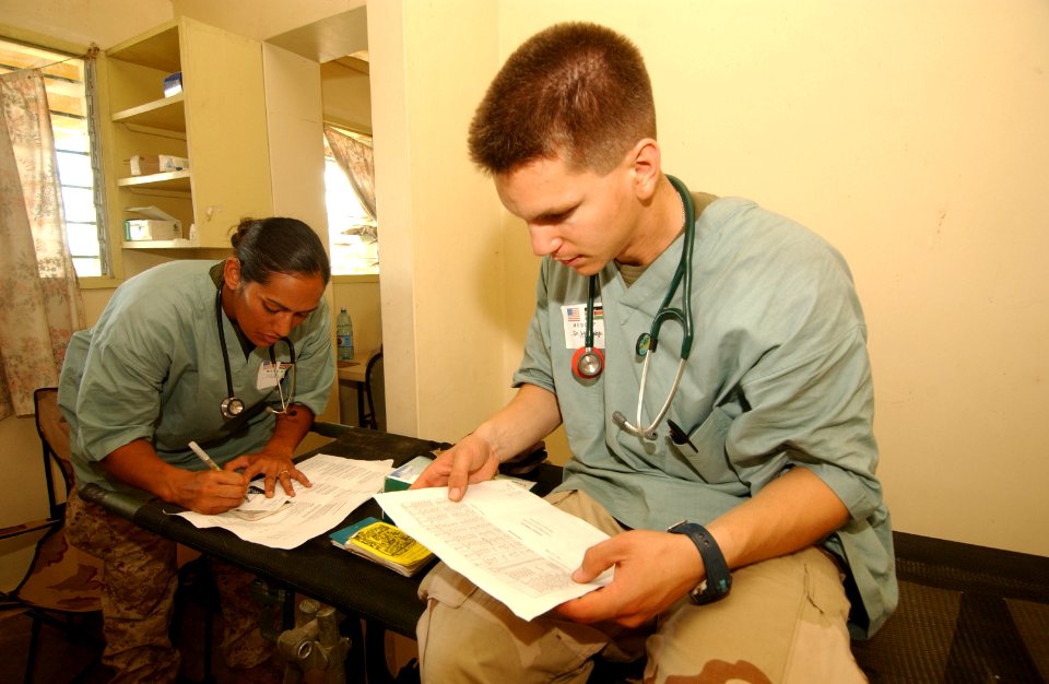 US Navy 040113-N-3236B-021 Hospital Corpsman 3rd Class Fetuao Maria Jackson from Diamond Bar, Calif., and Medical Officer, Lt. Mark Woodbridge medical personnel assigned to the 13th Marine Expeditionary Unit (MEU)