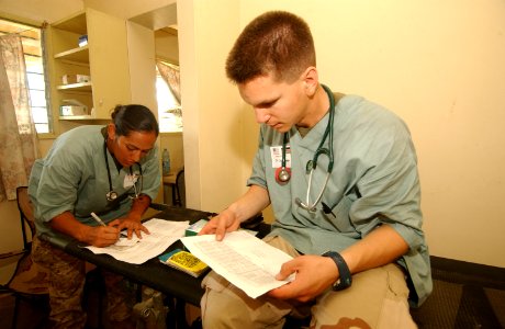 US Navy 040113-N-3236B-021 Hospital Corpsman 3rd Class Fetuao Maria Jackson from Diamond Bar, Calif., and Medical Officer, Lt. Mark Woodbridge medical personnel assigned to the 13th Marine Expeditionary Unit (MEU)