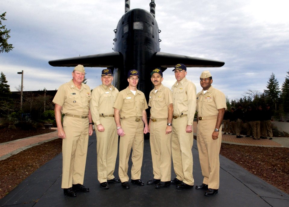 US Navy 040122-N-0141W-001 From left to right, Rear Adm. Paul Sullivan, Commander Submarine Force, U.S. Pacific Fleet, Cmdr. Brain Mcllvaine, Commanding officer USS Ohio (SSBN 726)
