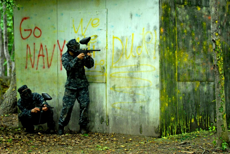 US Navy 110517-N-OA833-009 Plebes take cover during a paintball competition during Sea Trials, the capstone training exercise for Naval Academy fre