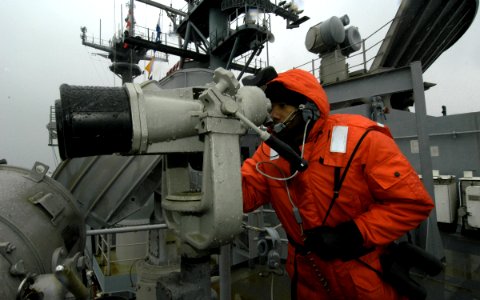 US Navy 040109-N-6204K-004 Signalman 3rd Class Brandon M. Gaines stands lookout watch aboard USS Iwo Jima (LHD 7)