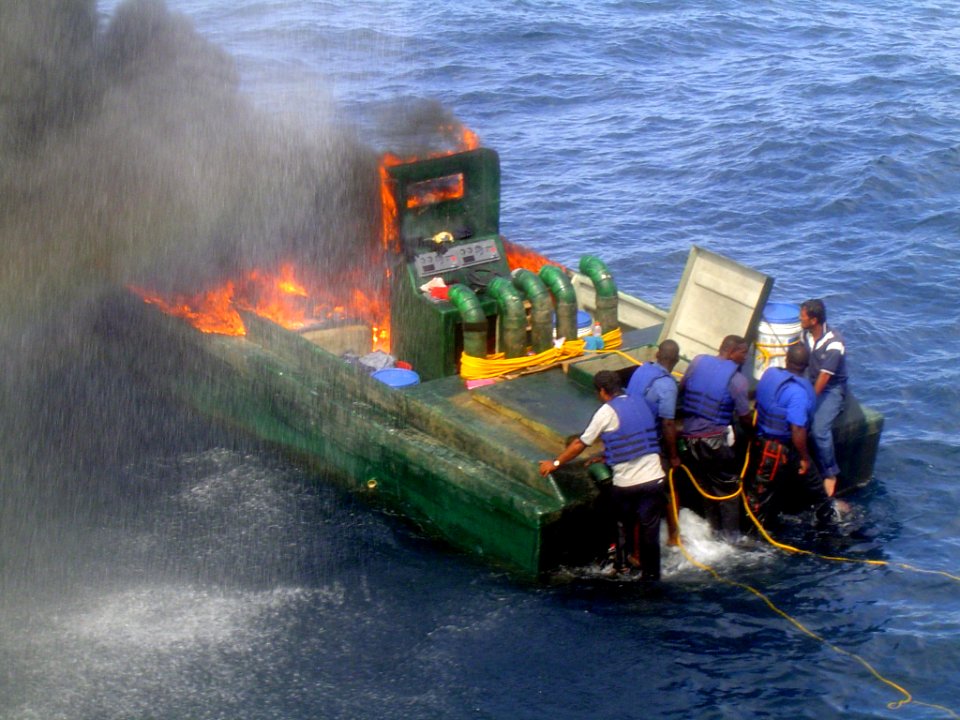 US Navy 040202-N-0000X-001 The crew aboard the 50 ft boat set their boat on fire to destroy contraband