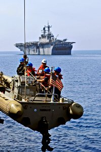 US Navy 110601-N-XO436-006 Sailors are lowered in a rigid-hull inflatable boat to conduct small boat operations with USS Bataan (LHD 5)