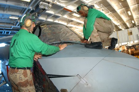 US Navy 031208-N-7575W-001 Aviation maintenance personnel work on a S-3B Viking assigned to the Fighting Redtails of Sea Control Squadron two one (VS-21) aboard USS Kitty Hawk (CV 63)