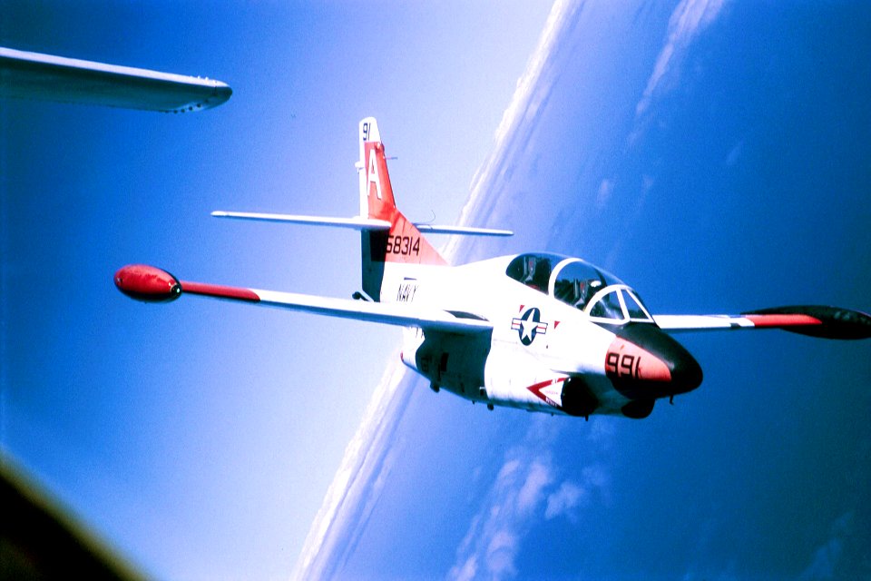 US Navy 040228-N-6842R-002 Lt. Allan Karlson, a student pilot assigned to the Tigers of Training Squadron Nine (VT-9), flies in formation in a T-2C Buckeye over Key West, Fla