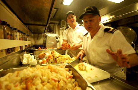 US Navy 040212-N-5319A-016 Sailors aboard the Canadian Navy Halifax-class patrol frigate HMCS Toronto (FFH 333), prepare freshly cooked lobster tail for lunch photo