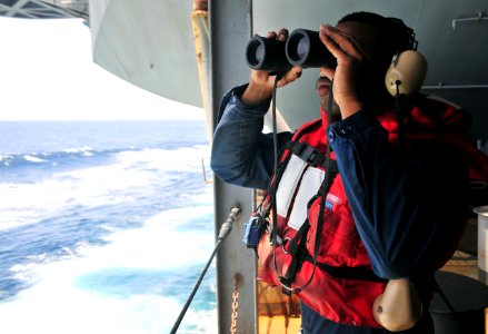 US Navy 110403-N-0074G-021 Seaman Devin R. Meadows stands the port quarter watch aboard the aircraft carrier USS Enterprise (CVN 65)