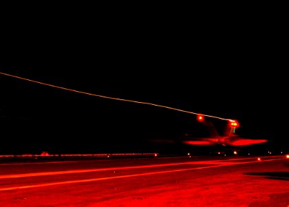 US Navy 040217-N-2325K-010 An F-A-18C Hornet strike fighter assigned to Carrier Air Wing Seven (CVW-7), makes a nighttime arrested landing on the flight deck aboard USS George Washington (CVN 73)