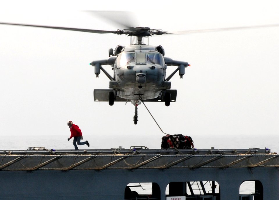 US Navy 110315-N-5538K-200 An MH-60S Sea Hawk helicopter transports humanitarian assistance supplies