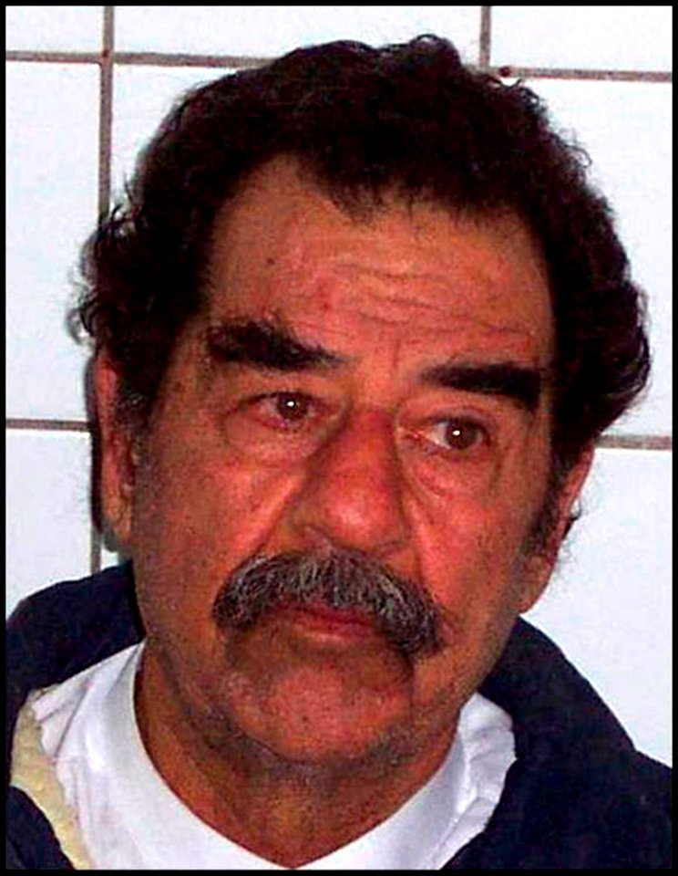 US Navy 031214-D-0000X-002 Former Iraqi leader Saddam Hussein following his capture by soldiers from the 1st Brigade Combat Team, 4th Infantry Division, in Tikrit, Iraq, Dec. 13, 2003