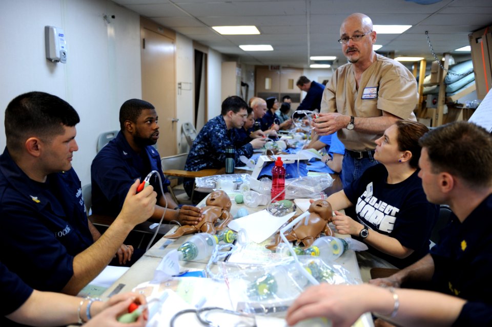 US Navy 110411-F-NJ219-029 Tom DiDonna teaches a Helping Babies Breathe training course aboard USNS Comfort (T-AH 20)