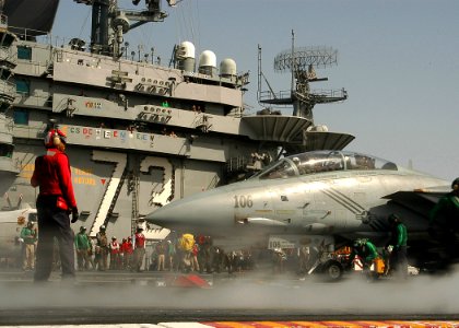 US Navy 040223-N-3986D-044 Flight deck personnel aboard USS George Washington (CVN 73) make final preparations for the launch of a F-14B Tomcat
