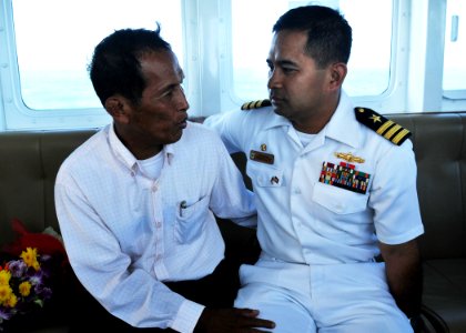 US Navy 101207-N-8721D-012 Cmdr. Michael Misiewicz spends some of his final moments in Cambodia with his uncle on a ferry ride back to USS Mustin (
