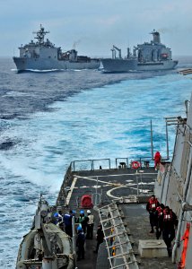 US Navy 110420-N-XO436-079 The guided-missile destroyer USS Barry (DDG 52) pulls ahead of a formation