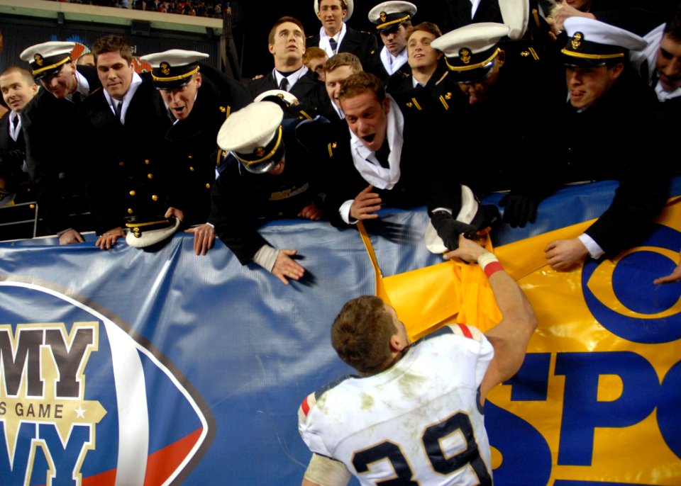 US Navy 101211-N-3857R-005 U.S. Naval Academy fullback Alexander Teich celebrates with fellow midshipmen after the 111th annual Army-Navy football