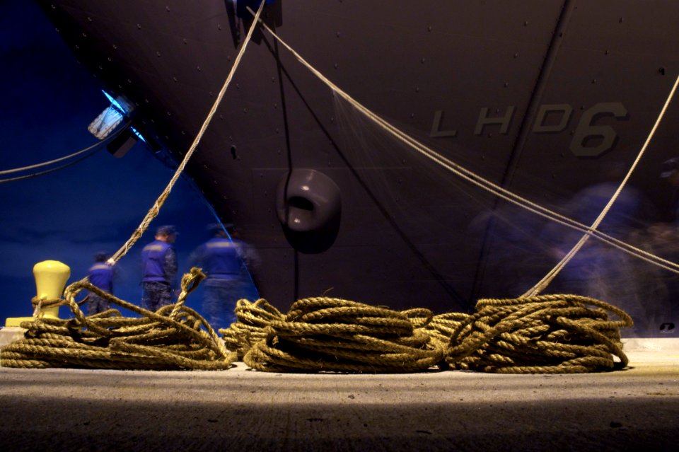 US Navy 110413-N-ZC343-514 Sailors tie USS Bonhomme Richard (LHD 6) to the pier after transiting from NASSCO dry dock to Naval Base San Diego