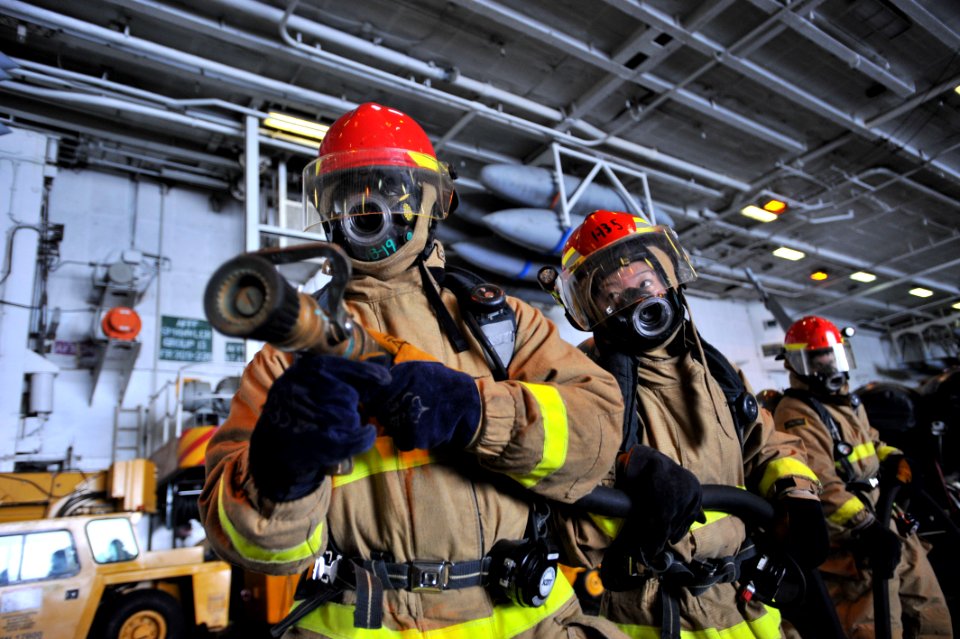 US Navy 110429-N-0569K-028 A hose team combats a simulated class bravo fire during a general quarters drill aboard USS Enterprise (CVN 65)