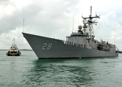 US Navy 110418-N-NL541-110 Sailors assigned to the guided-missile frigate USS Boone (FFG 28) man the rails as Boone departs Salvador, Brazil photo