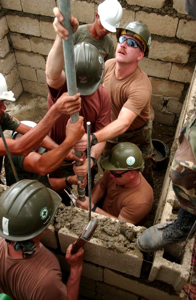 US Navy 040218-N-4142G-016 Navy Seabees attached to the Club and Spades of Naval Mobile Construction Battalion Two Five (NMCB 25), work shoulder-to-shoulder with Armed Forces of the Philippines (AFP)