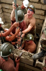 US Navy 040218-N-4142G-016 Navy Seabees attached to the Club and Spades of Naval Mobile Construction Battalion Two Five (NMCB 25), work shoulder-to-shoulder with Armed Forces of the Philippines (AFP)