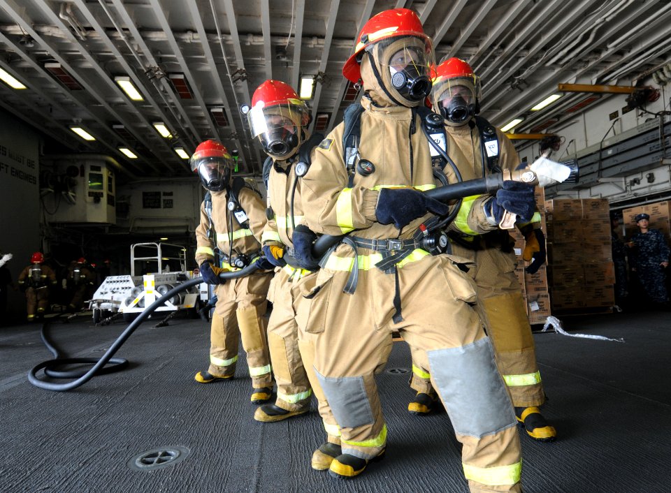 US Navy 110728-N-SO729-009 Sailors practice firefighting techniques during a damage control drill aboard USS Essex (LHD 2)