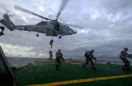 US Navy 040212-N-5319A-004 Members assigned to Explosive Ordnance Disposal Mobile Unit Six (EODMU 6) fast-rope from an HH-60H Seahawk helicopter