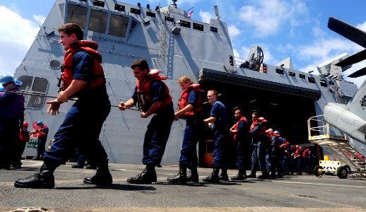 US Navy 110810-N-CT127-029 Sailors aboard the USS Mesa Verde heave a line during an UNREP