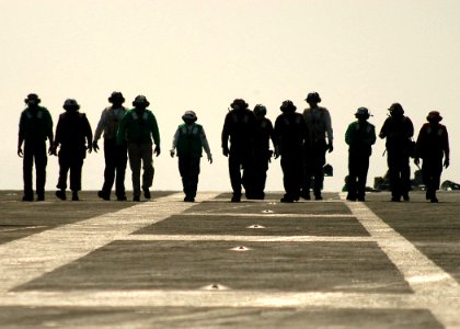 US Navy 040223-N-3986D-012 Crewmembers aboard USS George Washington (CVN 73) and Carrier Air Wing Seven (CVW-7) look for foreign object damage (FOD) on the flight deck