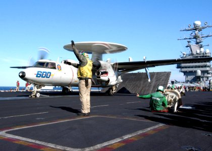 US Navy 040212-N-6278K-002 Lt. Cmdr. Lloyd Mack, from Pensacola, Fla., prepares an E-2C Hawkeye assigned to the Bluetails of Carrier Airborne Early Warning Squadron One Two One (VAW-121) for launch