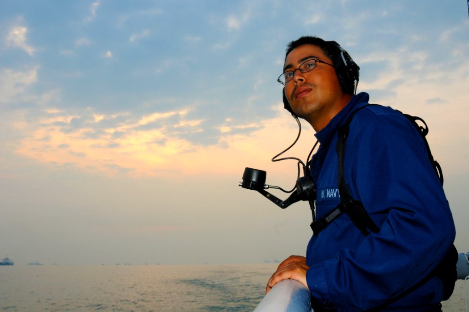 US Navy 110513-N-SP676-139 Logistics Specialist Manuel Torres stands aft lookout on the fantail of the mine countermeasures ship USS Avenger (MCM 1