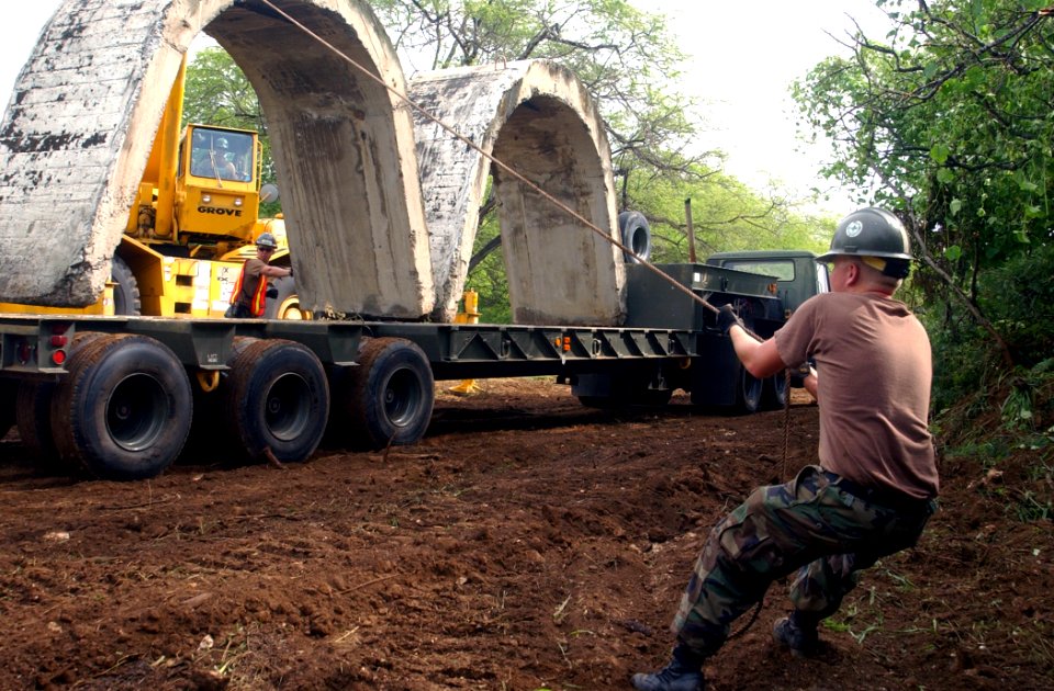 US Navy 040323-N-3019M-001 Equipment Operator Constructionman Jeff Glass helps to refurbish the Explosive Ordnance Disposal (EOD) range with the aid of a 40-ton cruiser crane