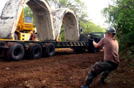 US Navy 040323-N-3019M-001 Equipment Operator Constructionman Jeff Glass helps to refurbish the Explosive Ordnance Disposal (EOD) range with the aid of a 40-ton cruiser crane