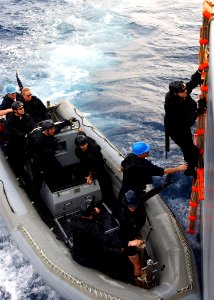 US Navy 040224-N-4374S-006 A member of the Vessel, Board, Search, and Seizure (VBSS) team assigned to the guided missile destroyer USS Roosevelt (DDG 80) climbs up on a ladder while boarding Training Support Vessel Prevail (TSV photo