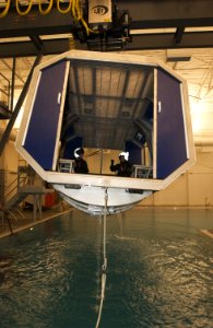 US Navy 040225-N-6436W-002 Instructors assigned to Naval Air Station (NAS) Whidbey Island's Aviation Survival Training Center prepare to demonstrate the Navy's new Modular Egress Training System