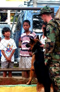US Navy 040226-N-4142G-043 U.S. Marine Corps Sgt. John Bell and his canine partner