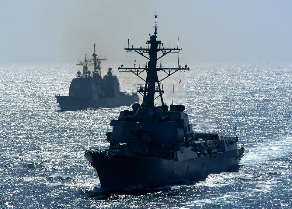 US Navy 040227-N-6278K-181 USS Bulkeley (DDG 84), right, and the guided missile cruiser USS Vella Gulf (CG 72) begin their approach on the Military Sealift Command (MSC) fast combat support ship USNS Supply (T-AOE 6), for an un