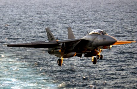 US Navy 040322-N-5319A-004 An F-14B Tomcat assigned to the Red Rippers of Fighter Squadron One One (VF-11) approaches the flight deck of USS George Washington (CVN 73) during evening flight operations