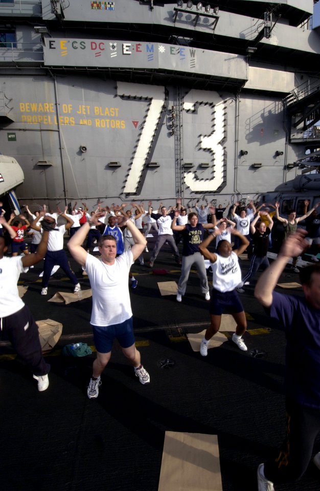 US Navy 040327-N-5319A-007 Sailors aboard USS George Washington (CVN 73) take the opportunity to workout on the flight deck during a no-fly day while operating in the Arabian Gulf