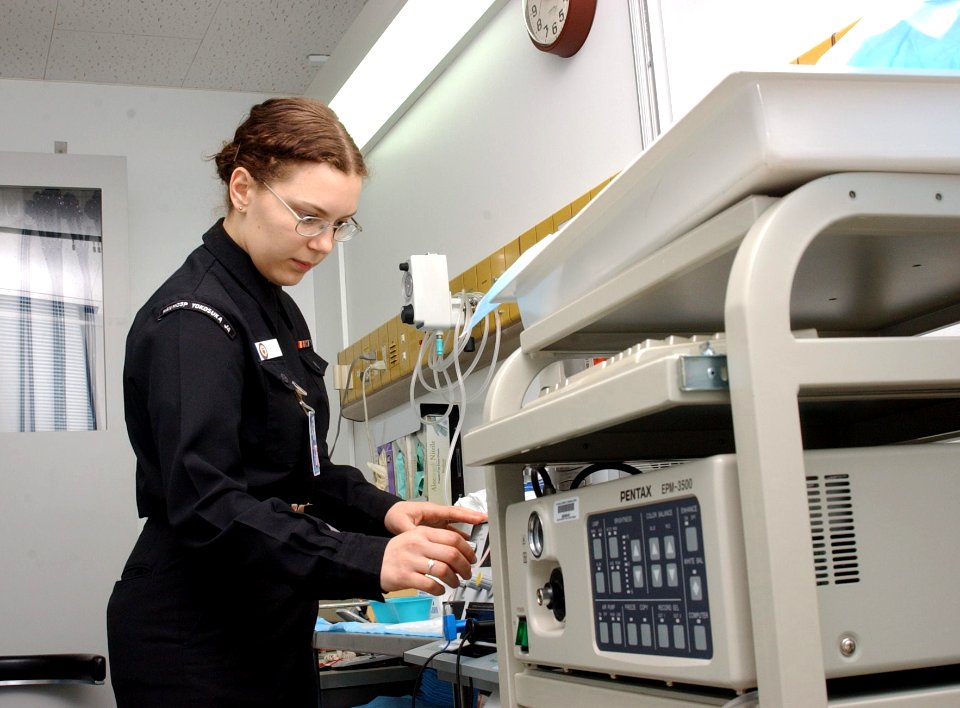 US Navy 040323-N-0000W-031 Hospital Corpsman 3rd Class Leslie White adjusts and checks equipment in the Surgery Clinic at U.S. Naval Hospital, Yokosuka, Japan