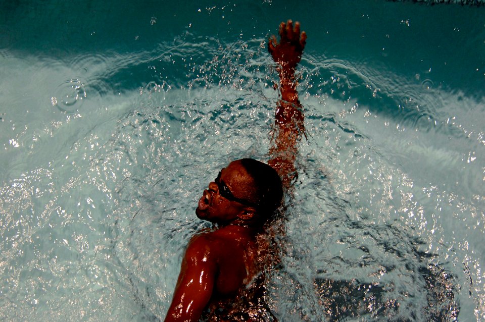 US Navy 110520-N-CD297-071 Aviation Ordnanceman 2nd Class Selemani Johnson swims in the 100-meter Freestyle event as a member of Team Navy-Coast Gu
