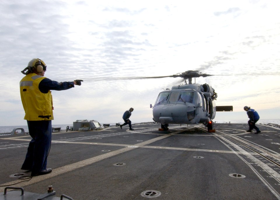US Navy 040309-N-4374S-009 An MH-60S Knighthawk assigned to the Dragon Whales of Helicopter Combat Support Squadron Eight (HC-8) prepares to launch from the flight deck aboard the guided missile frigate Taylor (FFG 50)