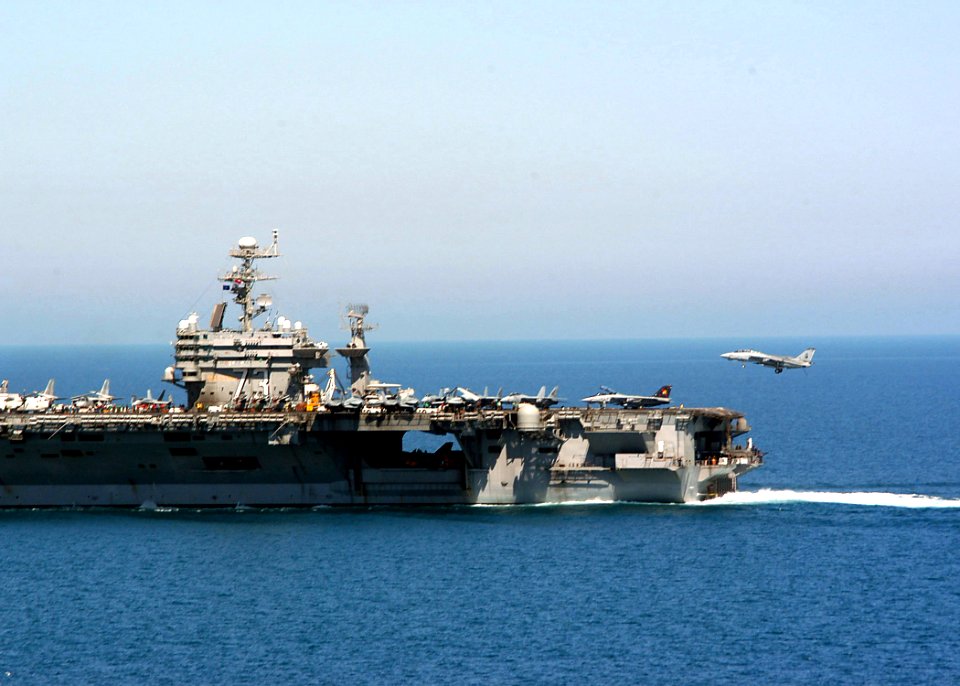 US Navy 040324-N-6278K-139 An F-14B Tomcat assigned to the Red Rippers of Fighter Squadron One One (VF-11) prepares to make an arrested landing on the flight deck aboard USS George Washington (CVN 73)