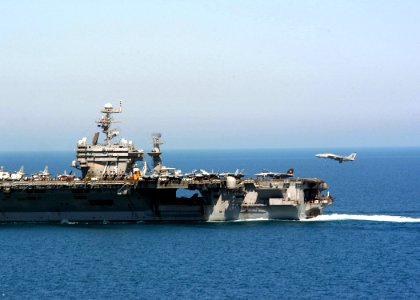 US Navy 040324-N-6278K-139 An F-14B Tomcat assigned to the Red Rippers of Fighter Squadron One One (VF-11) prepares to make an arrested landing on the flight deck aboard USS George Washington (CVN 73)